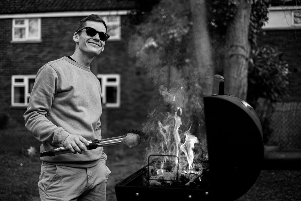 Joel cooking at a BBQ