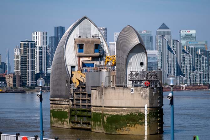 The Thames Barrier with Canary Wharf in the distance