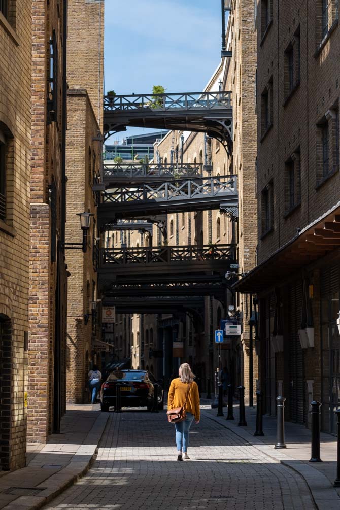 A girl walk down an old street called Shad Thames, near Tower Bridge
